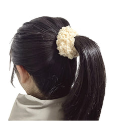 Grutyopkn scrunchies in a handbag for travel-ready hair styling convenience