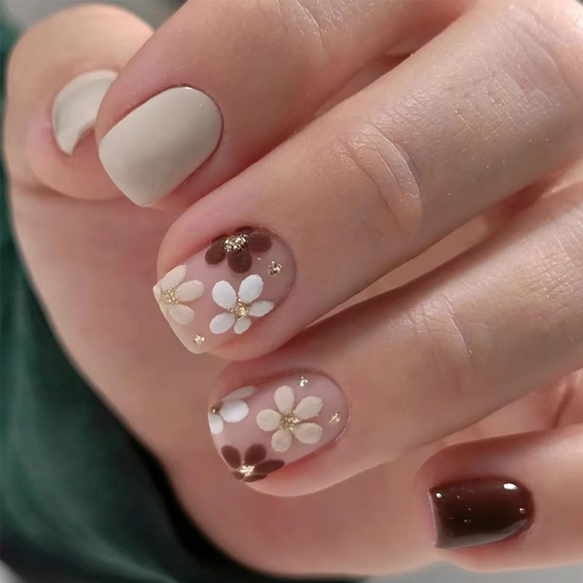 GUFUGU adhesive tabs close-up with nails being lifted to show easy, gentle removal