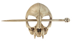 GuoShuang skull side profile showing aged-bone finish and polished edges benefit