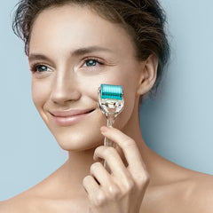 GXBRSY derma roller held in hand showing scale and easy ergonomic control