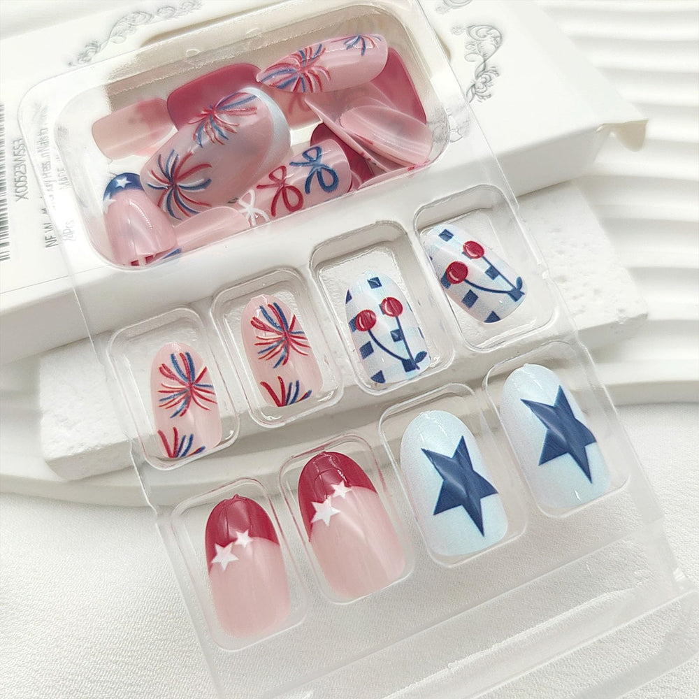 GXOIPNS applied nails on hands in patriotic setting highlighting instant holiday style