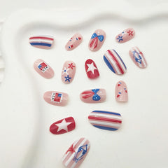 GXOIPNS nails worn on hand in patriotic setting, demonstrating festive short almond-oval fit