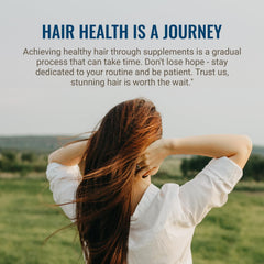 Hair La Vie bottle on a plant backdrop conveying natural botanicals and calm routine