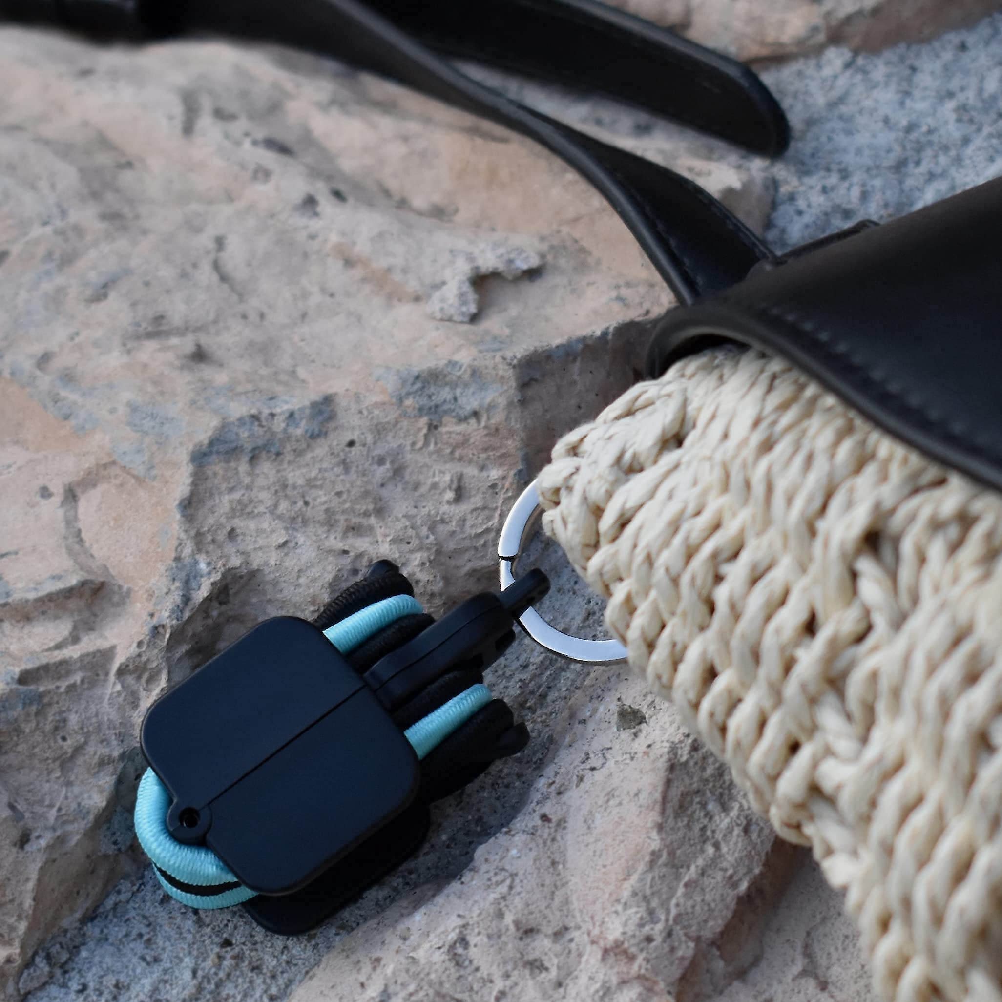 Hair Tie Hub clipped on backpack strap showing easy access benefit
