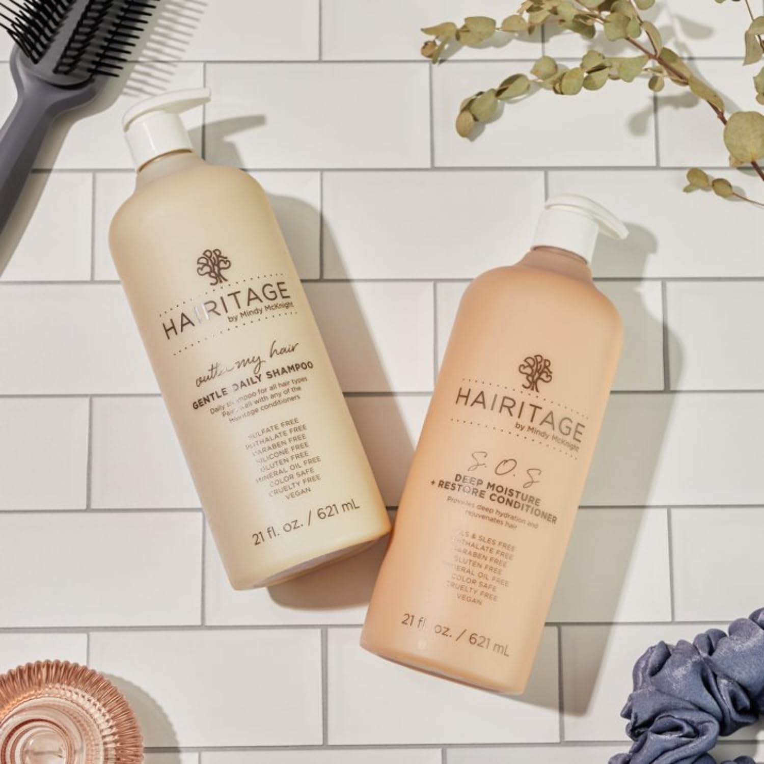 Hairitage shampoo lather texture in hand, demonstrates lightweight creamy foam benefit