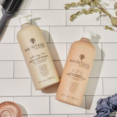 Hairitage shampoo lather texture in hand, demonstrates lightweight creamy foam benefit