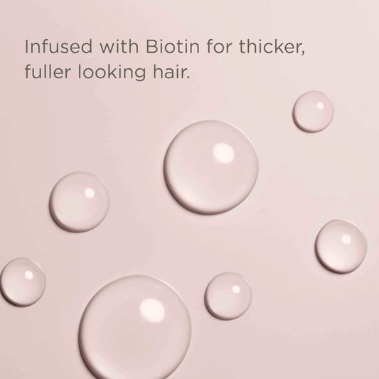 Hairitage serum applied to scalp demonstrating targeted use and lightweight absorption benefit