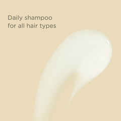 Hairitage shampoo lather in hand demonstrating gentle cleansing