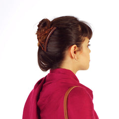 HairZing comb securing a neat bun on wavy hair for comfortable all-day wear
