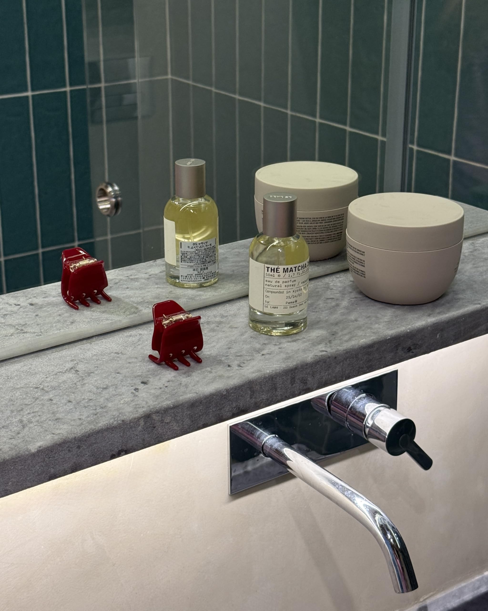 Hana Mia clip in hand to show 1-inch scale and lightweight convenience