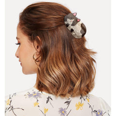 Hapdoo side profile of clip highlighting curved jaw and smooth acetate finish