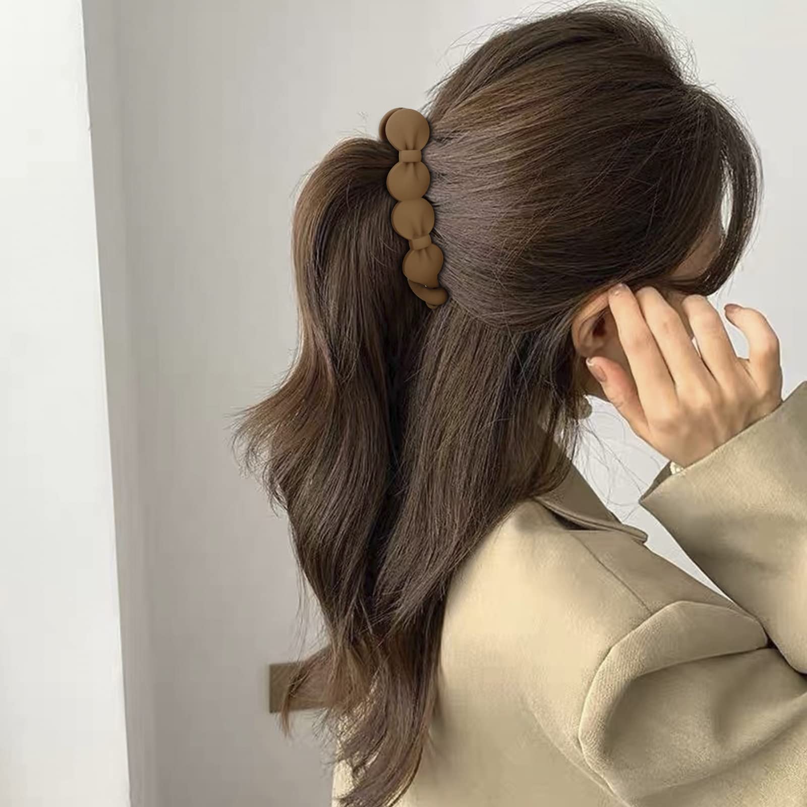 Hapdoo clip used to create a low bun for neat everyday looks