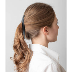 Hapdoo lifestyle image of woman wearing dark blue clip showcasing retro style