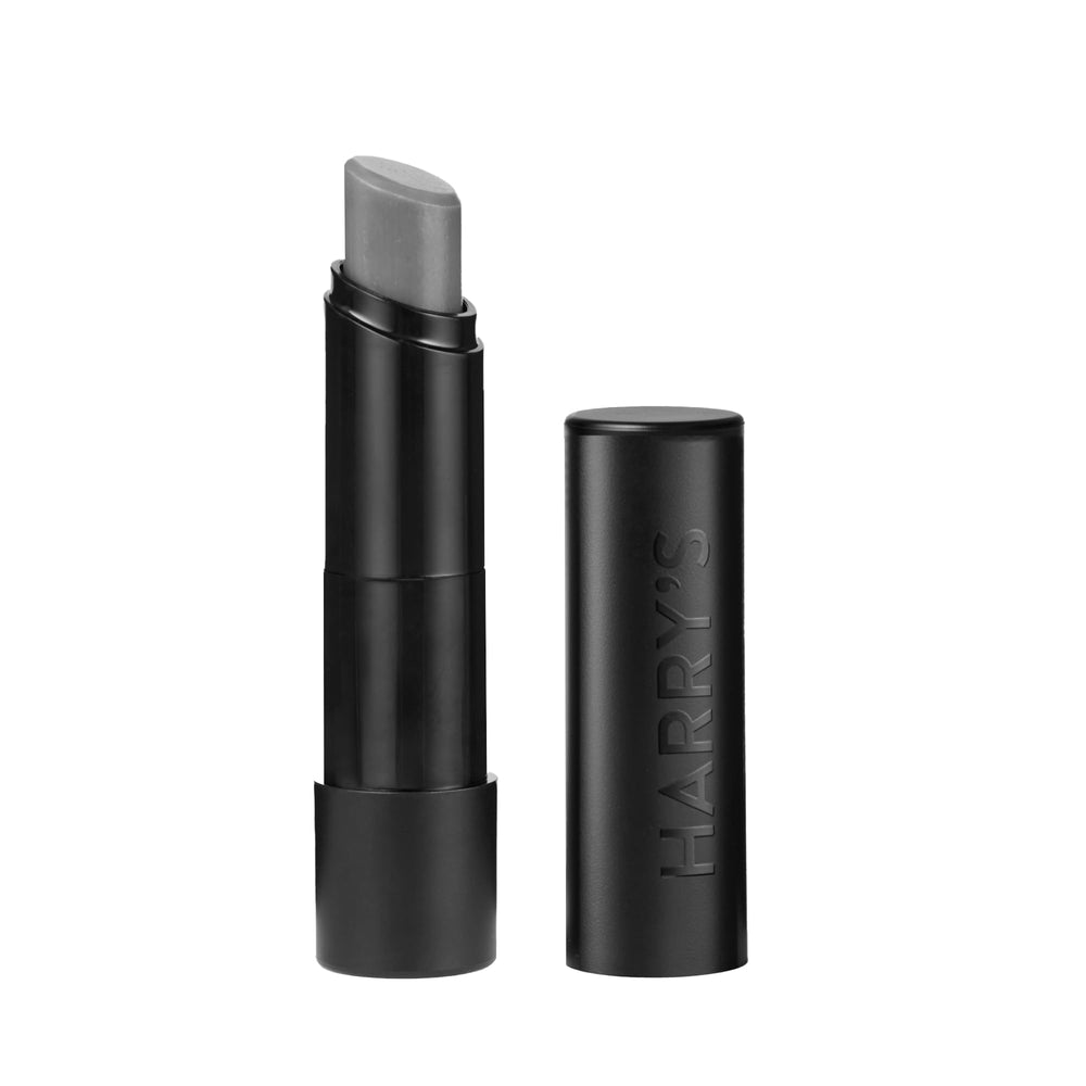 Harry's black lip balm front tube showing sleek matte design and easy grip