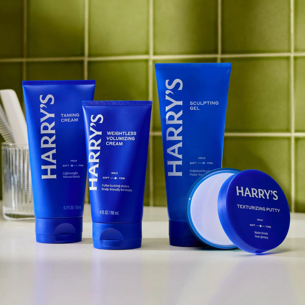 Harry's cream on bathroom counter styled with grooming tools for daily routine benefit