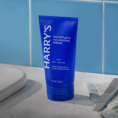 Harry's 4 fl oz cream in hand showing travel-friendly size benefit