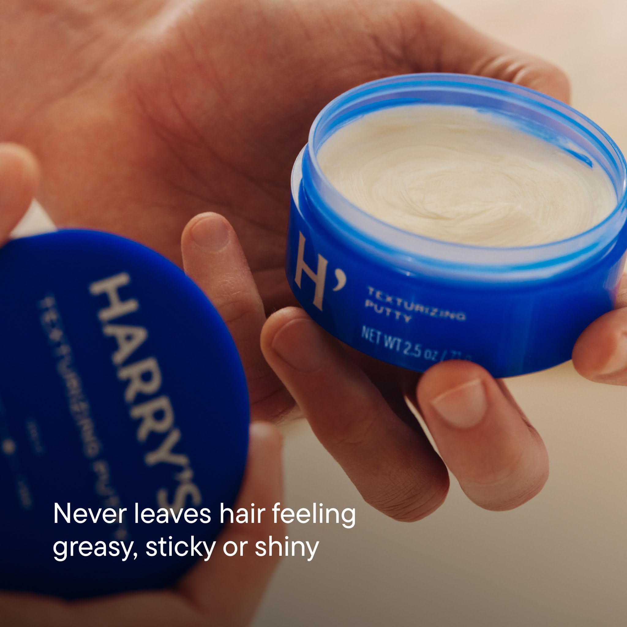Harry's putty on hands demonstrating easy warming and workability