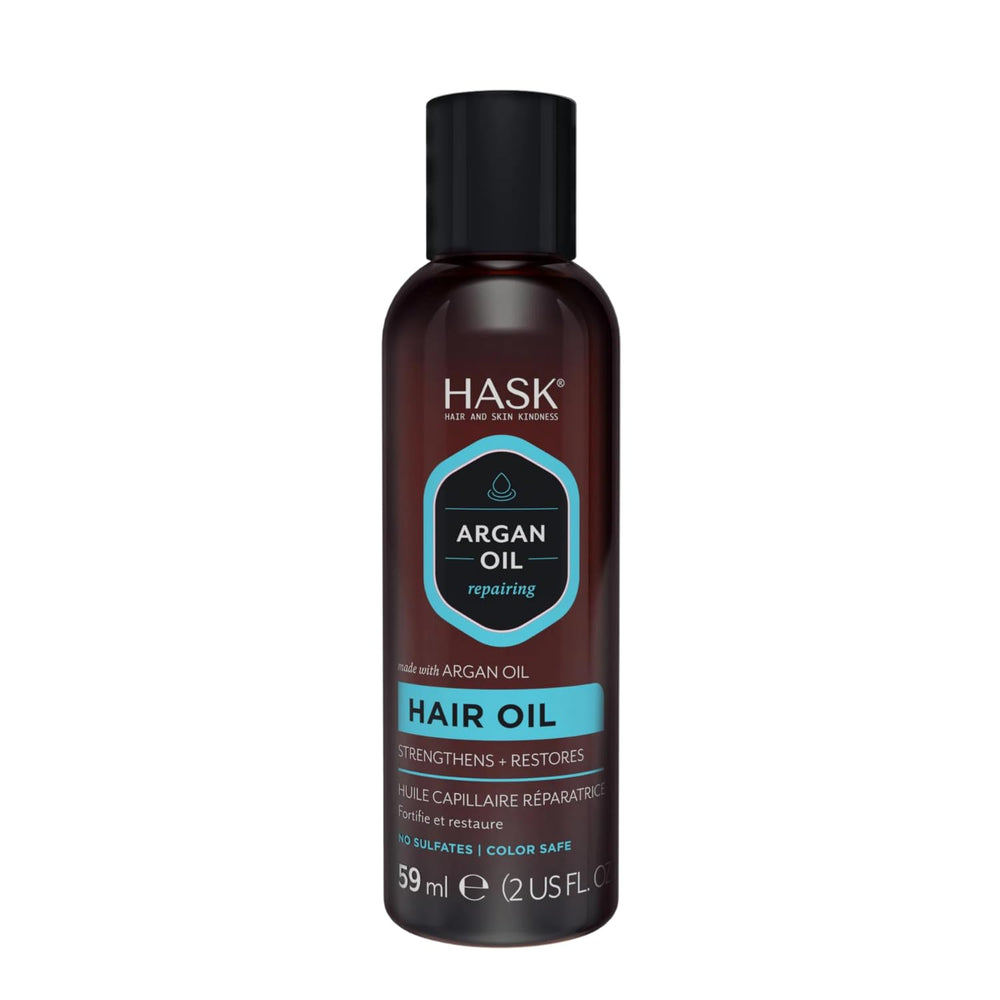 HASK oil rubbed into hands demonstrating even spread and non-greasy finish