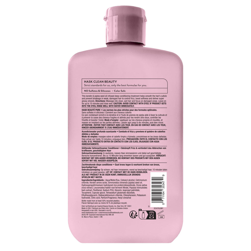 HASK bottle in hand for scale, showing 8 fl oz travel-friendly size
