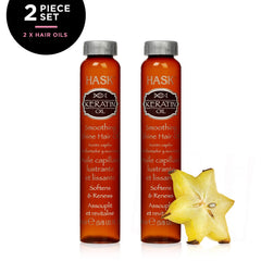 HASK keratin oil vial next to a coin size comparison for dosing benefit