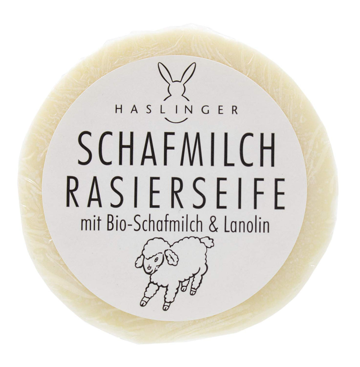 Haslinger shaving soap puck front view showing label and benefits