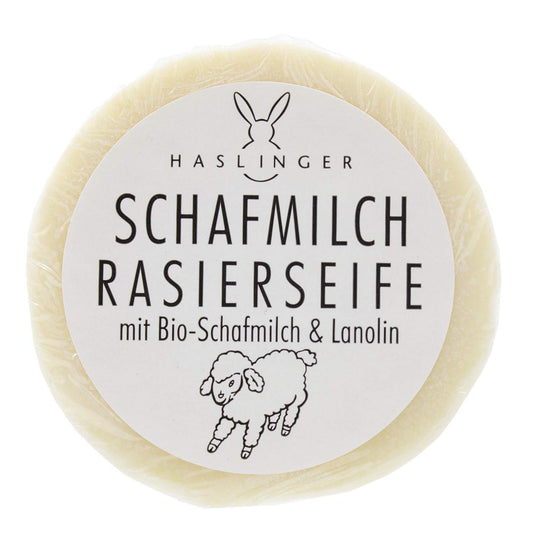 Haslinger shaving soap puck front view showing label and benefits