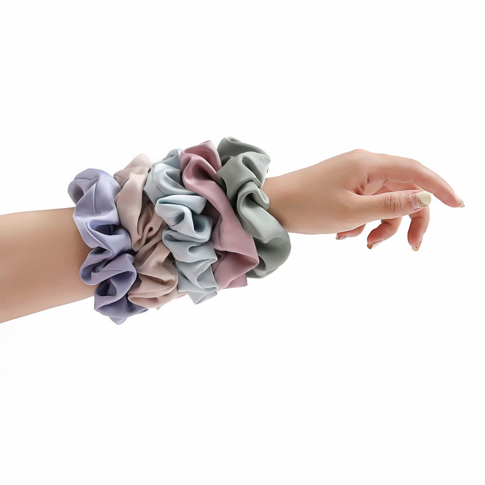 Helamvly scrunchie styled in a bun demonstrating volume and no-damage hold