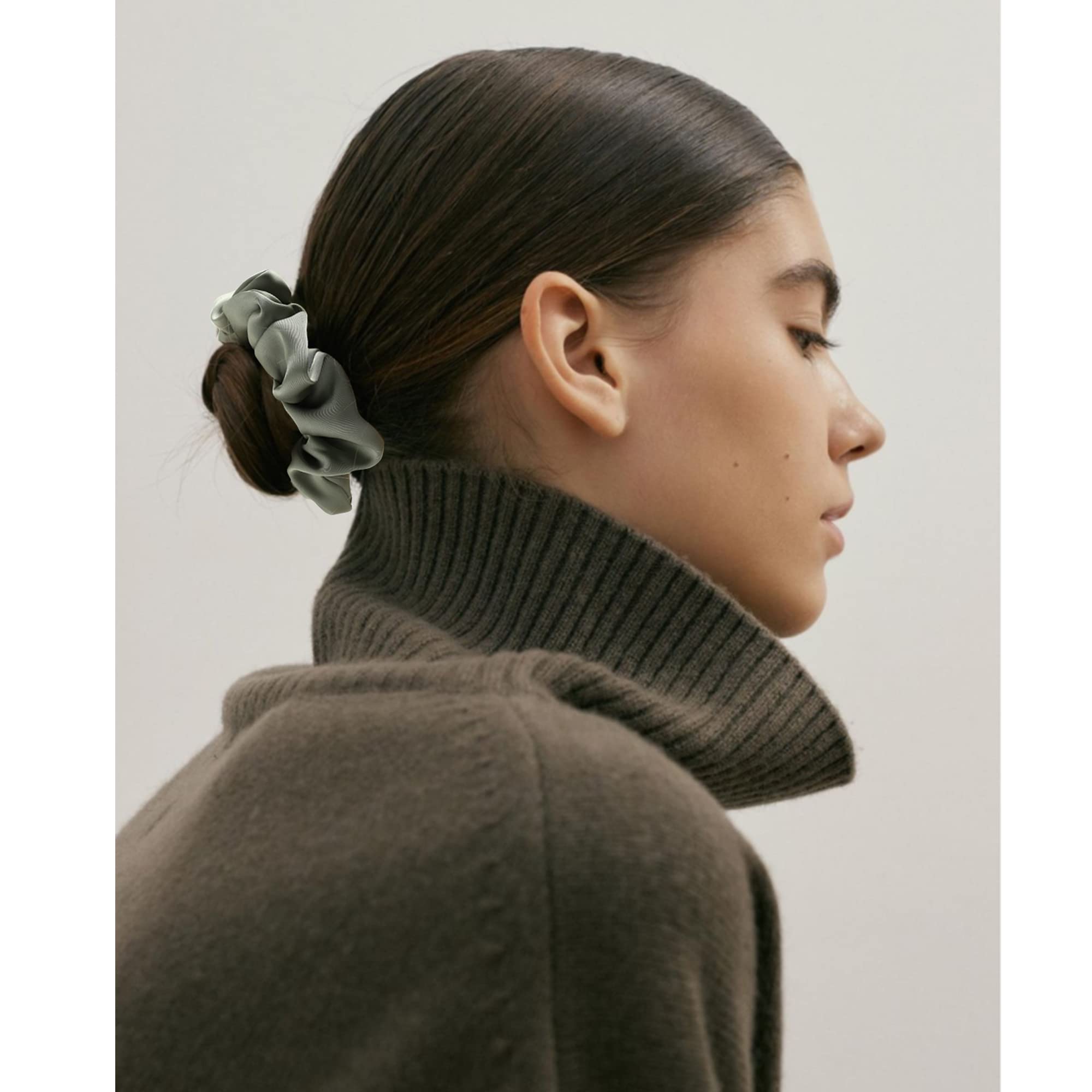 Helamvly scrunchie in a ponytail on model showing secure hold and polished look