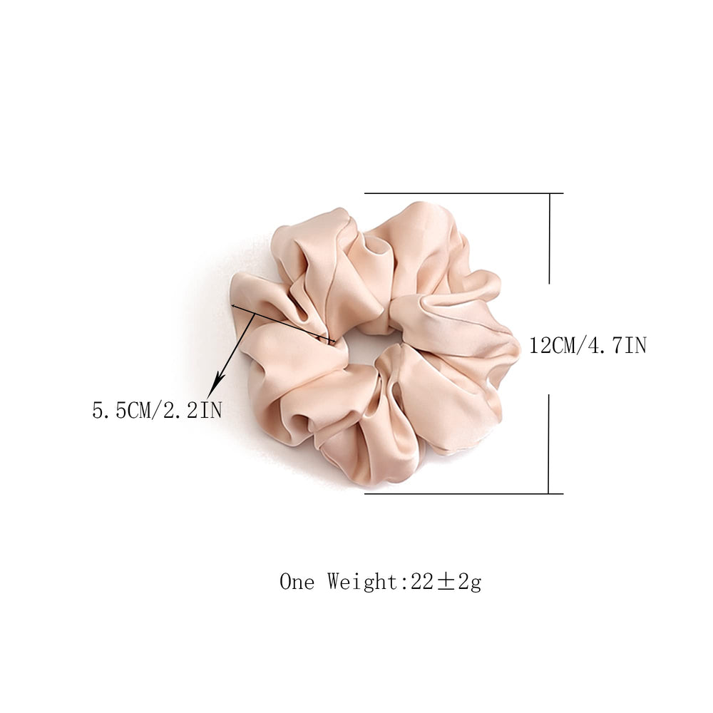 Helamvly scrunchie beside a hand for scale showing jumbo size and generous elastic