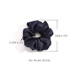 Helamvly scrunchie worn in a high ponytail showing smooth finish benefit no creases