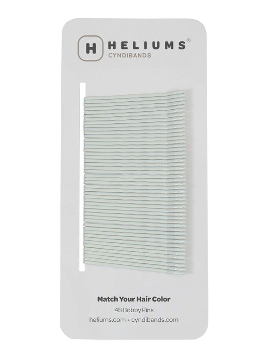 Heliums front-packaging showing 48 white bobby pins blending with hair
