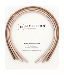 Heliums front view of four slim headbands showing neutral shades and tidy packaging benefit comfortable selection