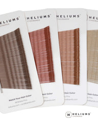 Heliums pins in a stylist kit portraying professional, color-matched tools