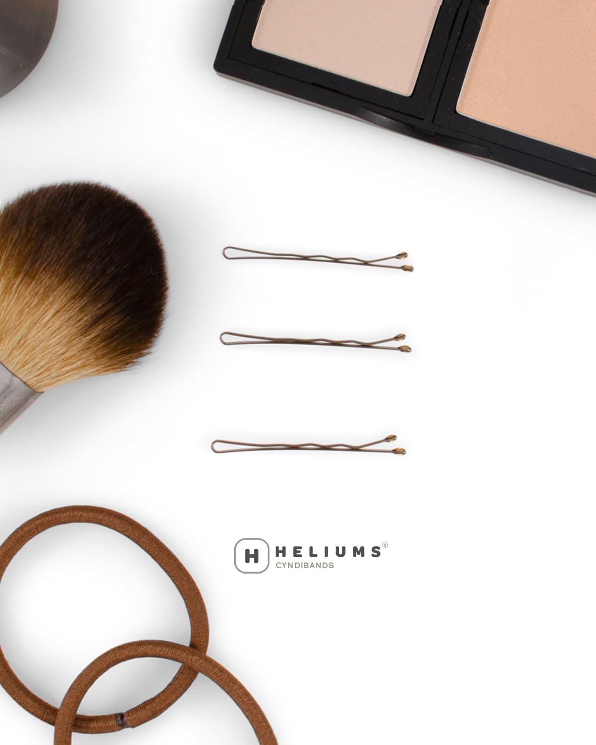 Heliums matte gray pin beside shiny silver pin to show low-reflective benefit