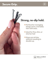 Heliums mini bobby pin held in hand to show 1.5-inch size and scale