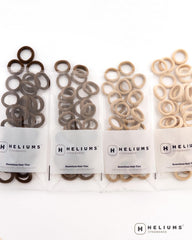 Heliums size comparison with coin illustrating tiny 0.7-inch scale and discreet look