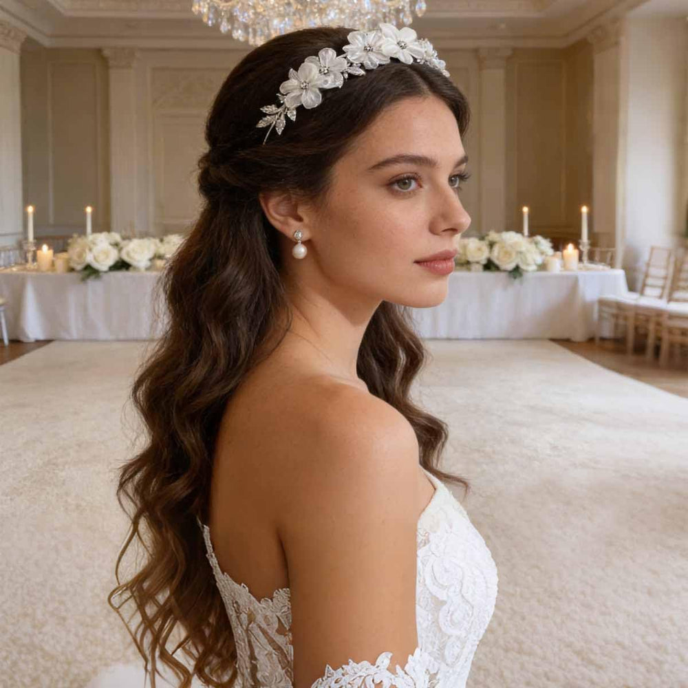 Heogacinlia headband beside hand for scale showing lightweight portable design benefit