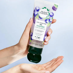 Herbal Essences being scrunched into curls showing defined bounce benefit