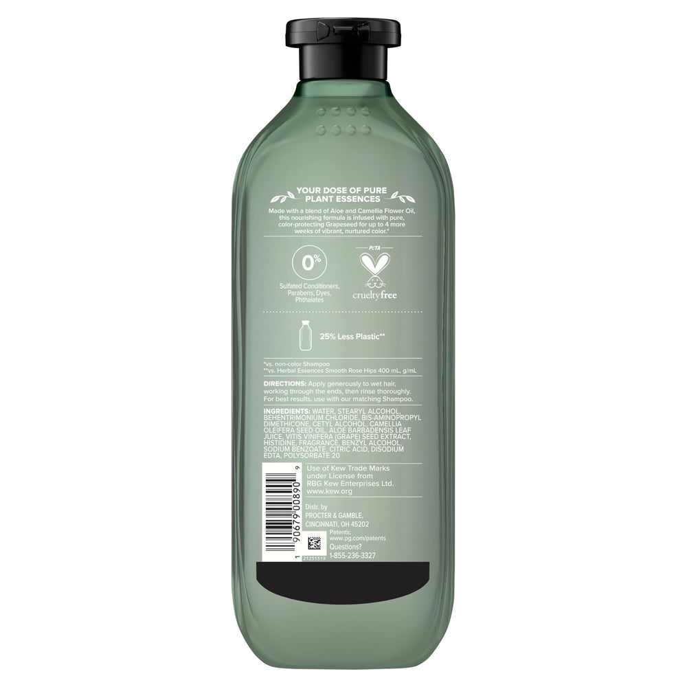 Herbal Essences bottle on bathroom shelf styled with plants for natural feel
