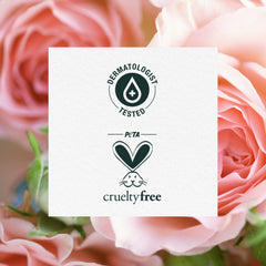 Herbal Essences bottle arranged with rose petals to evoke floral scent and natural extracts
