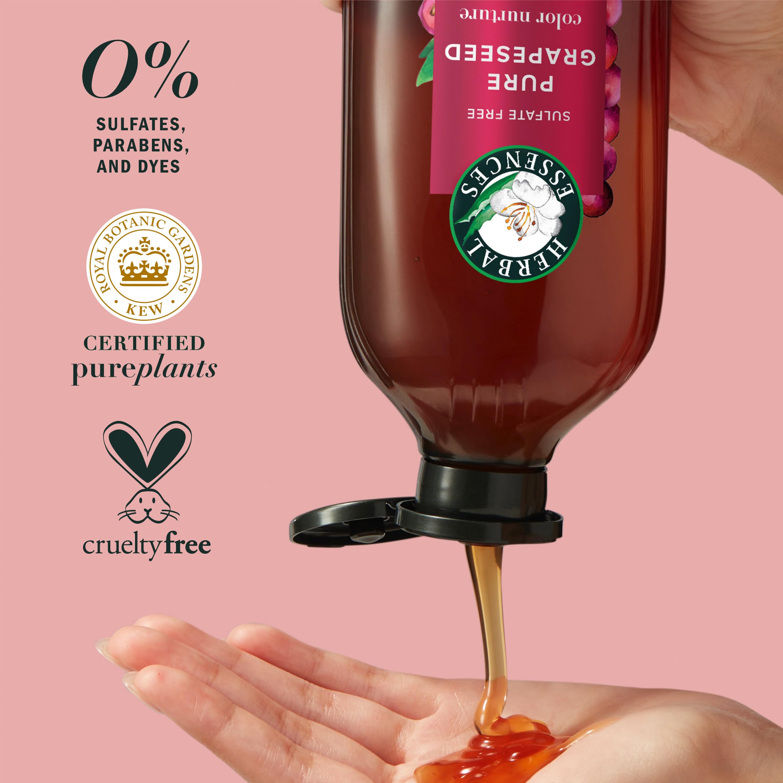 Hand holding Herbal Essences shampoo while applying for easy lather