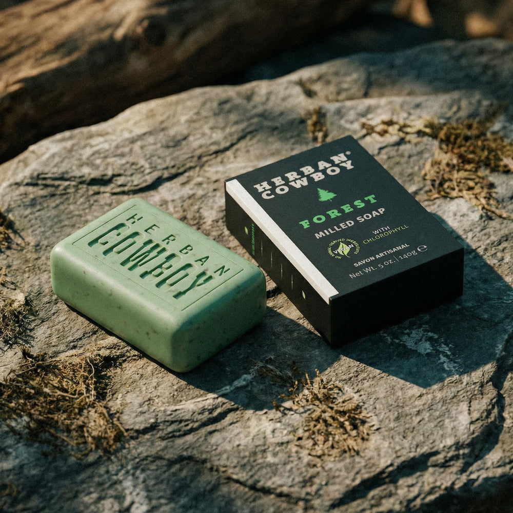Herban Cowboy soap on shower shelf in lifestyle scene conveying modern outdoorsy scent