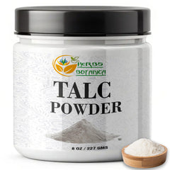 Herbs Botanica talc dispensed on skin demonstrating dry, non-greasy comfort
