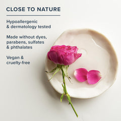 HERITAGE STORE rose and olive squalane ingredients beside bottle highlighting botanical soothing and moisturizing benefits