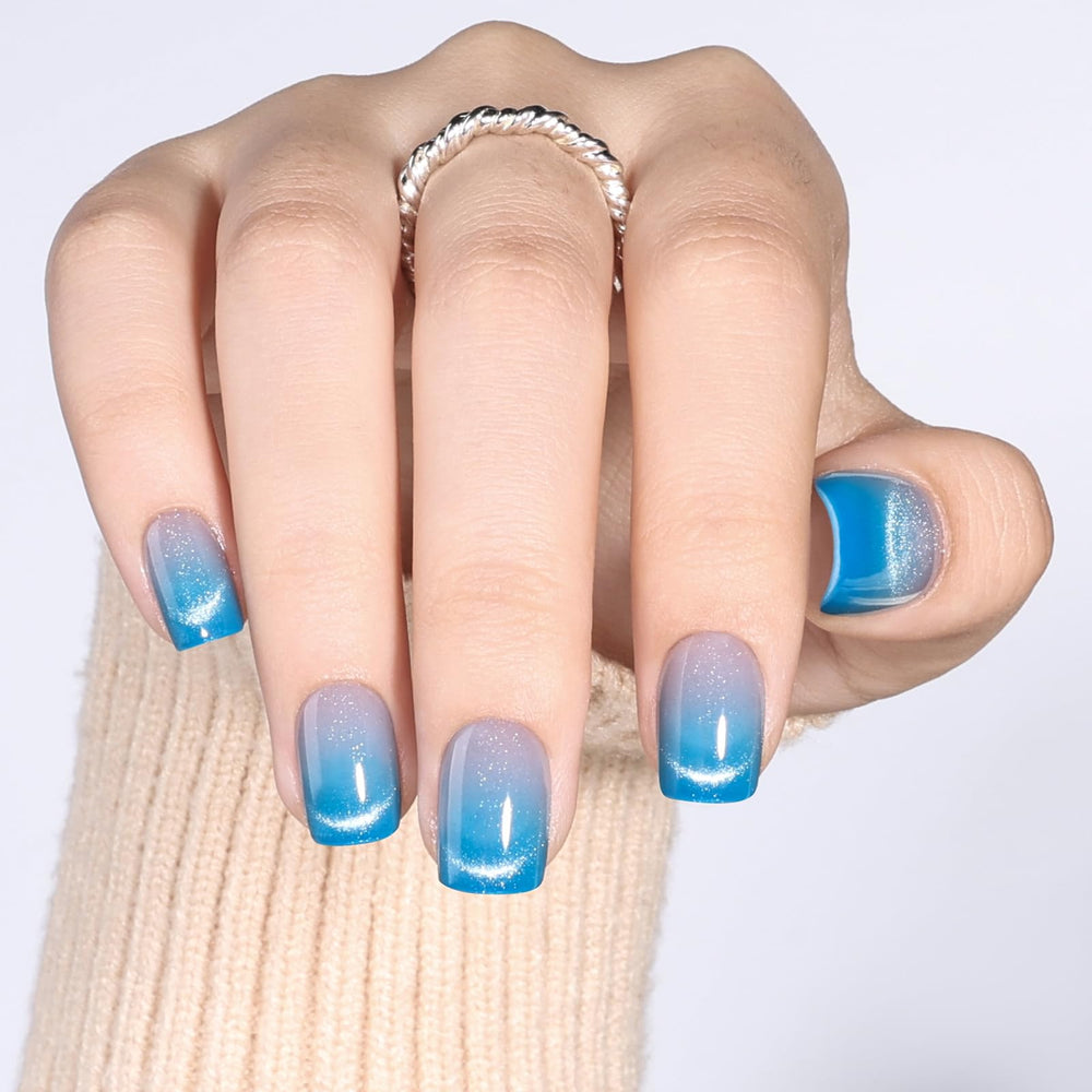 Herlight nails beside coin showing scale and precise sizing benefit