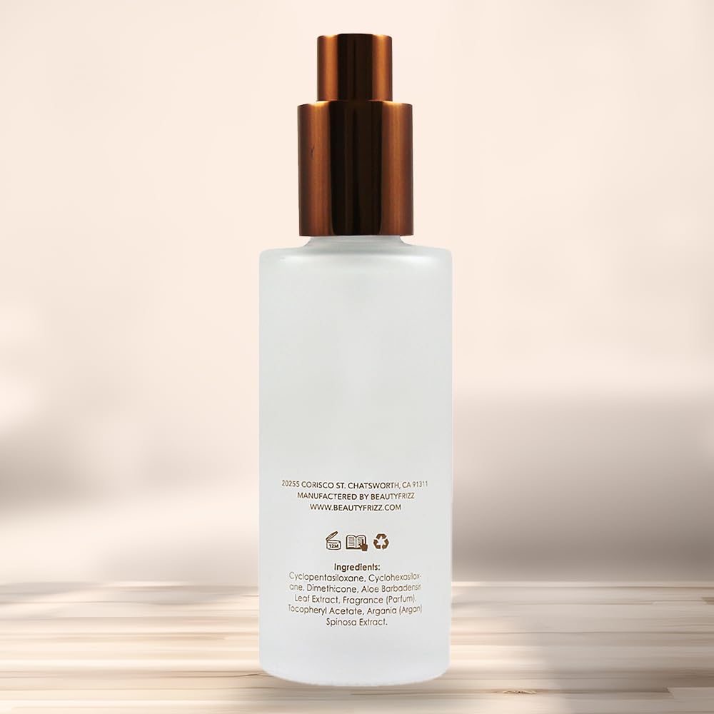 ingredients label close-up on HerStyler bottle showing argan oil, vitamin E, aloe vera