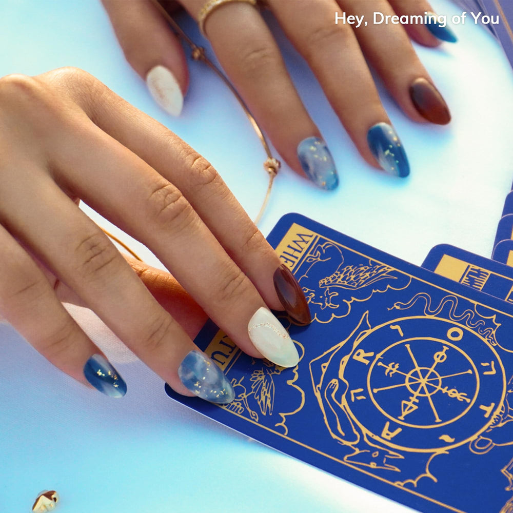 heyhae applying a strip to a fingernail for quick at-home salon results