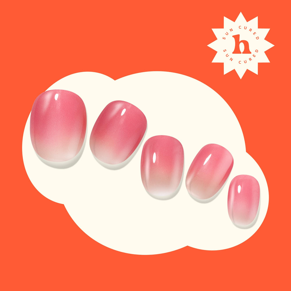 heyhae finished manicure on model hand showcasing glossy gradient and wear