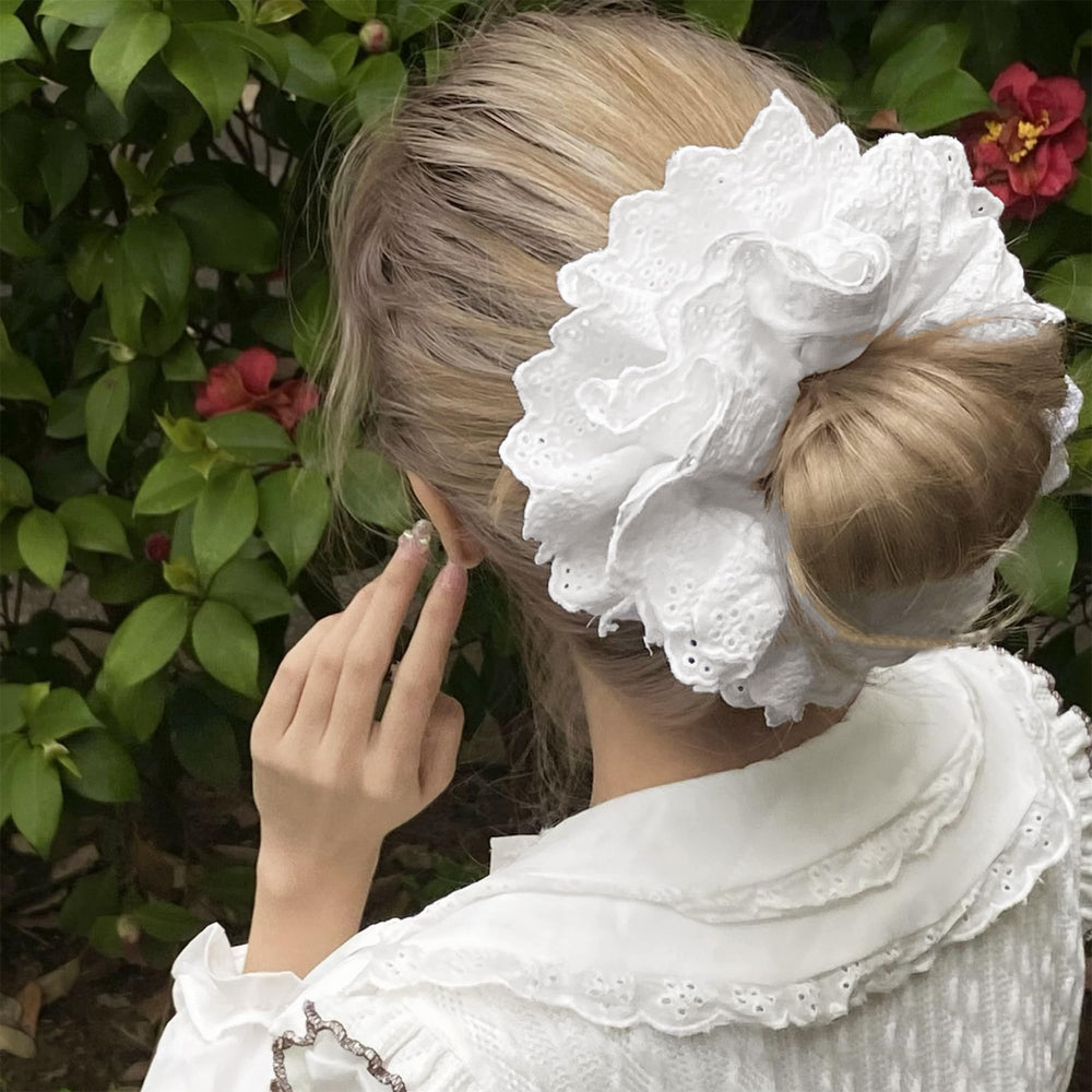 Heyiminy side profile bun style showcasing fluffy support and neat finish