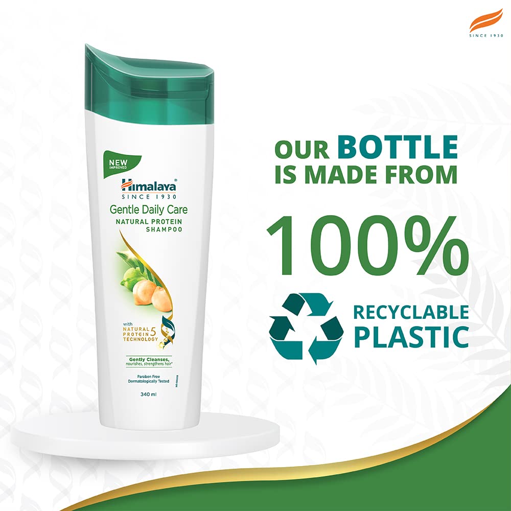 Himalaya shampoo bottle next to common items to show 13.53 oz scale